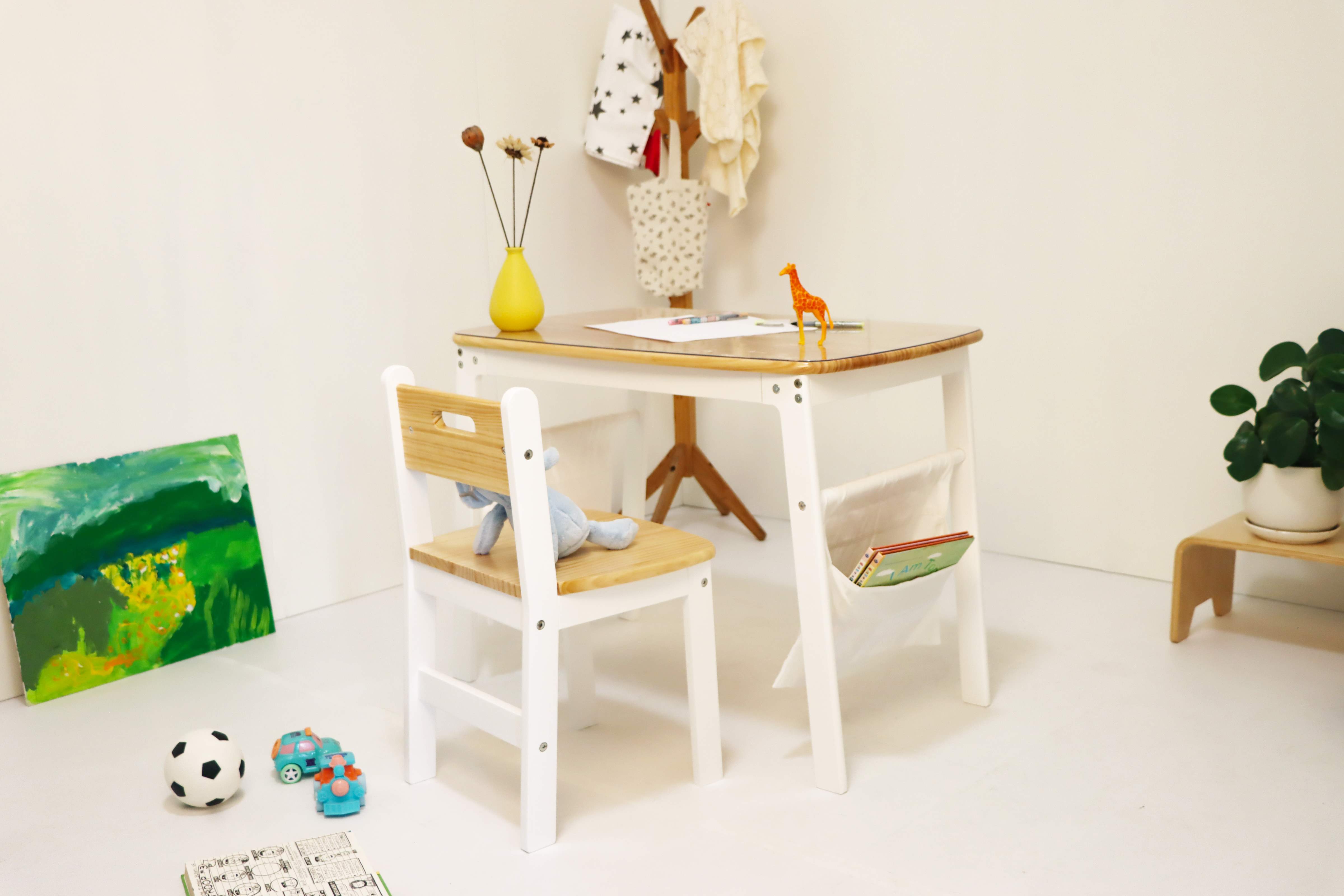 Reversible desk with canvas storage bags. Straight or curved modes. Montessori-inspired organization. Ages 3-8.
