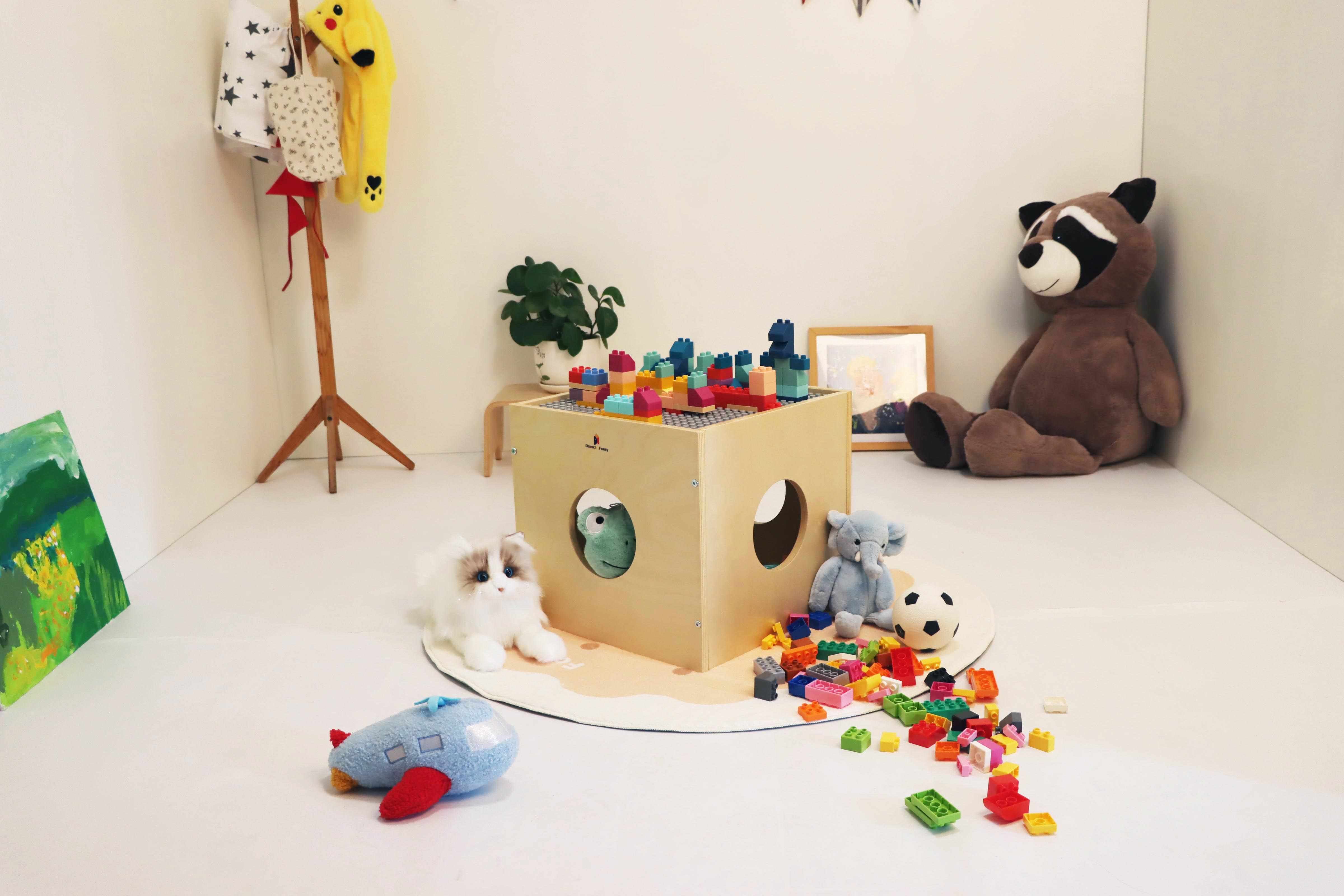 Montessori wooden play cube with storage holes. Activity table and hideout. Non-toxic. Includes base plate and blocks.
